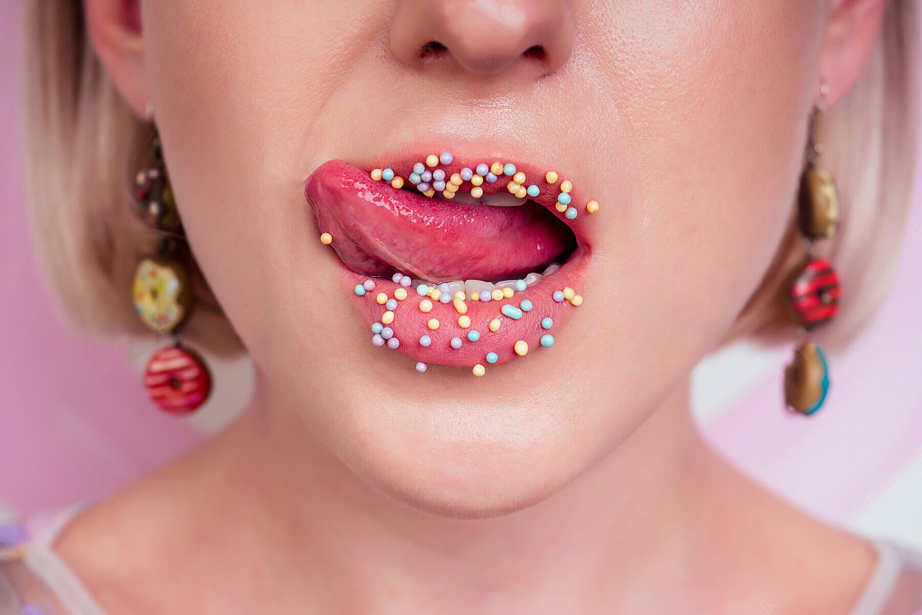Top 10 Things to Keep in Mind Portrait Beautiful Blonde Barbie Woman Perfect Makeup Tongue Sexy Licking Lip Donuts Earrings